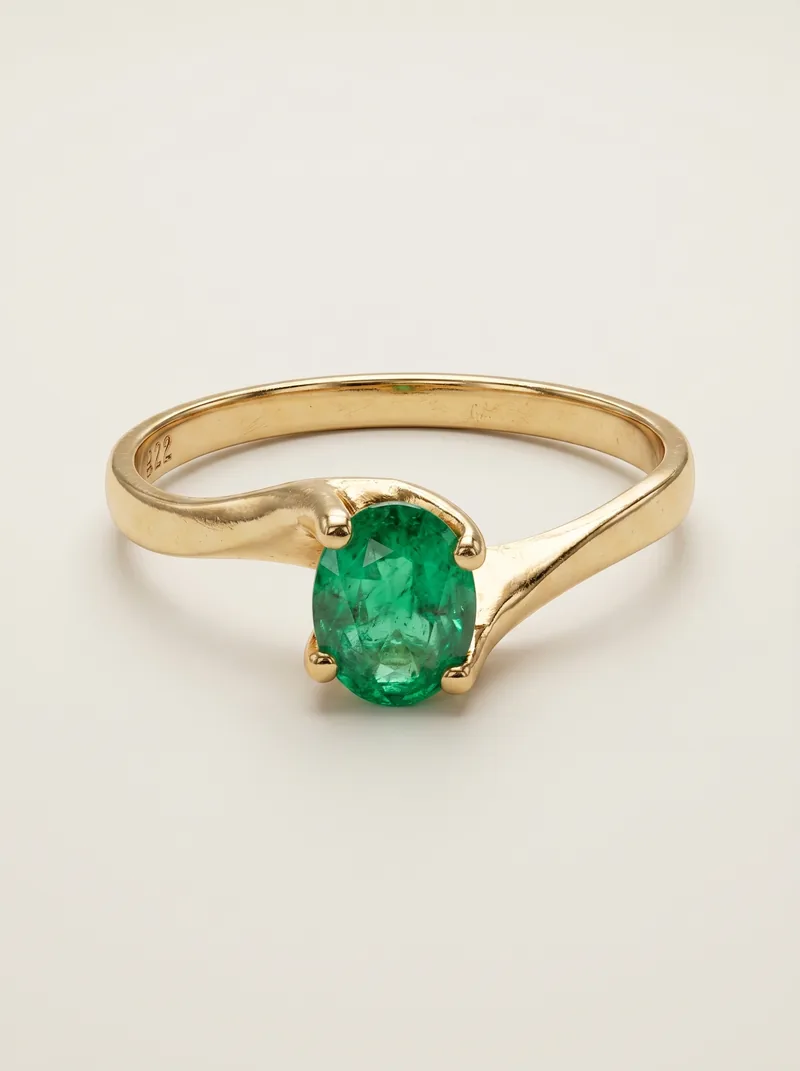 Anillo oro con esmeralda redonda